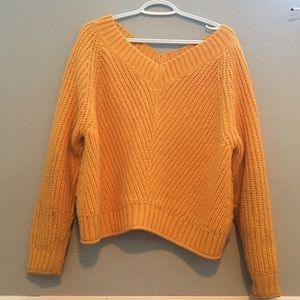 Yellow knitted V- neck sweater kinda cropped size medium.